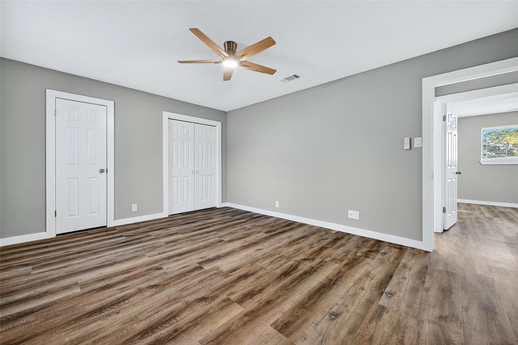 3014 Jennifer Avenue Denison, TX 75020 - Photo 10 of 23 a view of a livingroom with wooden floor and white walls