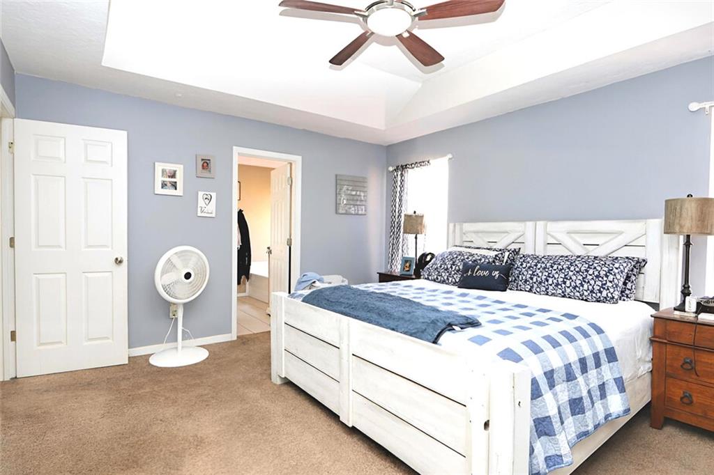 34 Clay Court Villa Rica, GA 30180 - Photo 8 of 15 a bedroom with a bed and painting on the wall