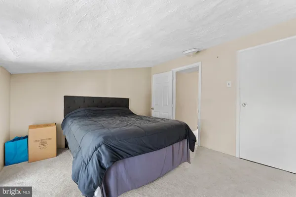 a bedroom with a bed and a cabinets