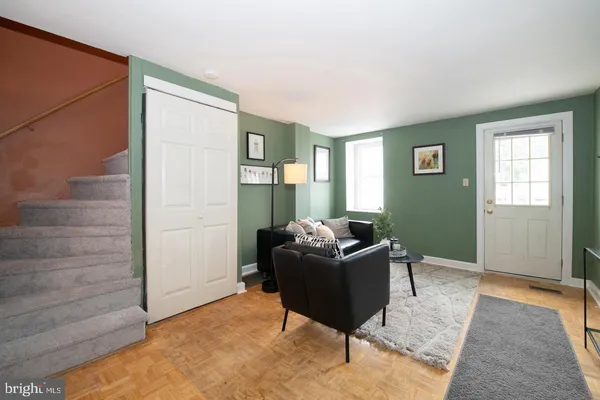 a living room with furniture and a window