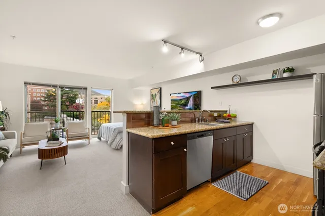 a kitchen with a sink and cabinets