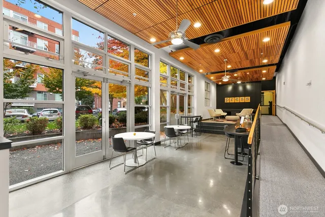 a building outdoor space with patio furniture and potted plants
