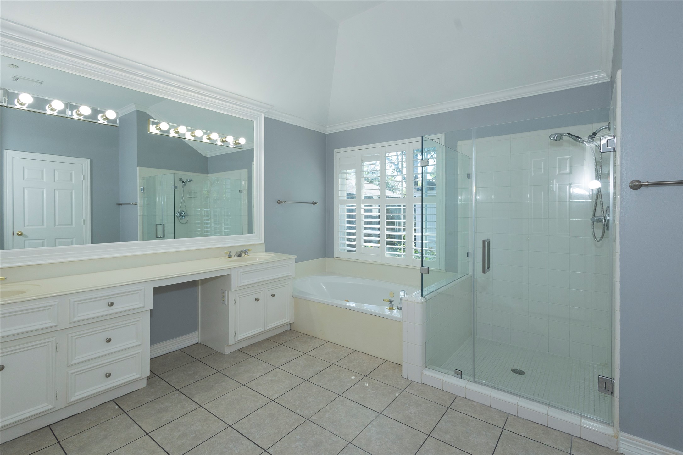 4402 Prince Pine Trail Houston, TX 77059 - Photo 14 of 23 a spacious bathroom with a shower a sink and mirror