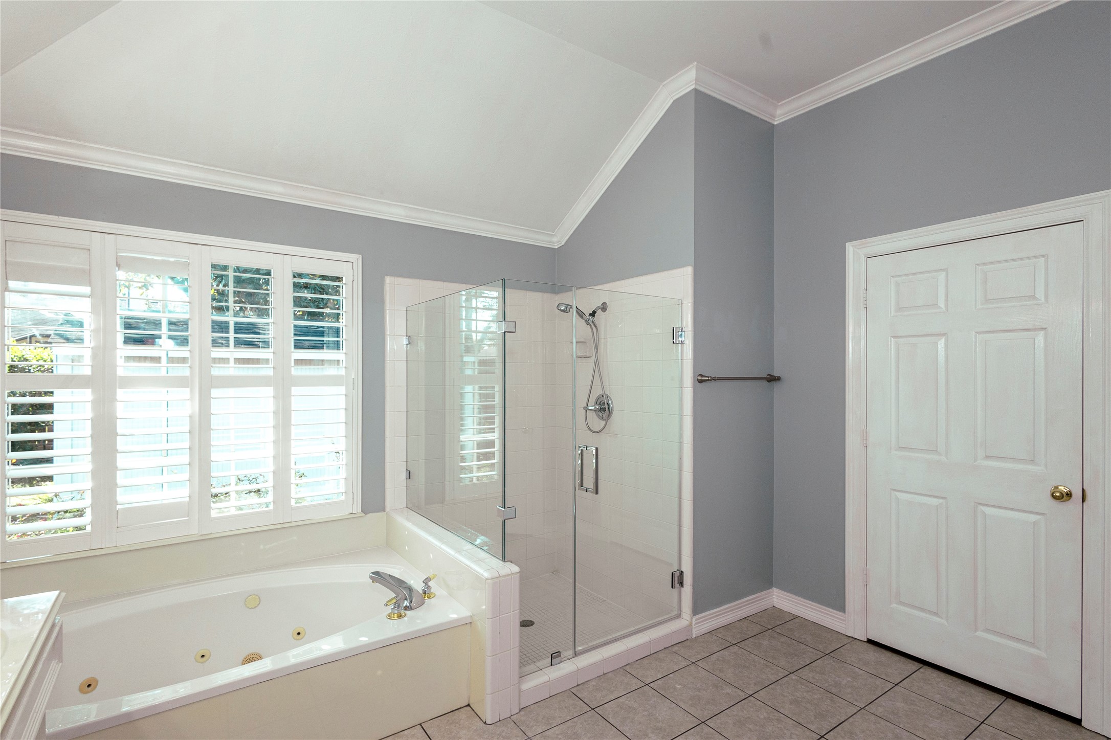 4402 Prince Pine Trail Houston, TX 77059 - Photo 15 of 23 a bathroom with a bathtub and a shower
