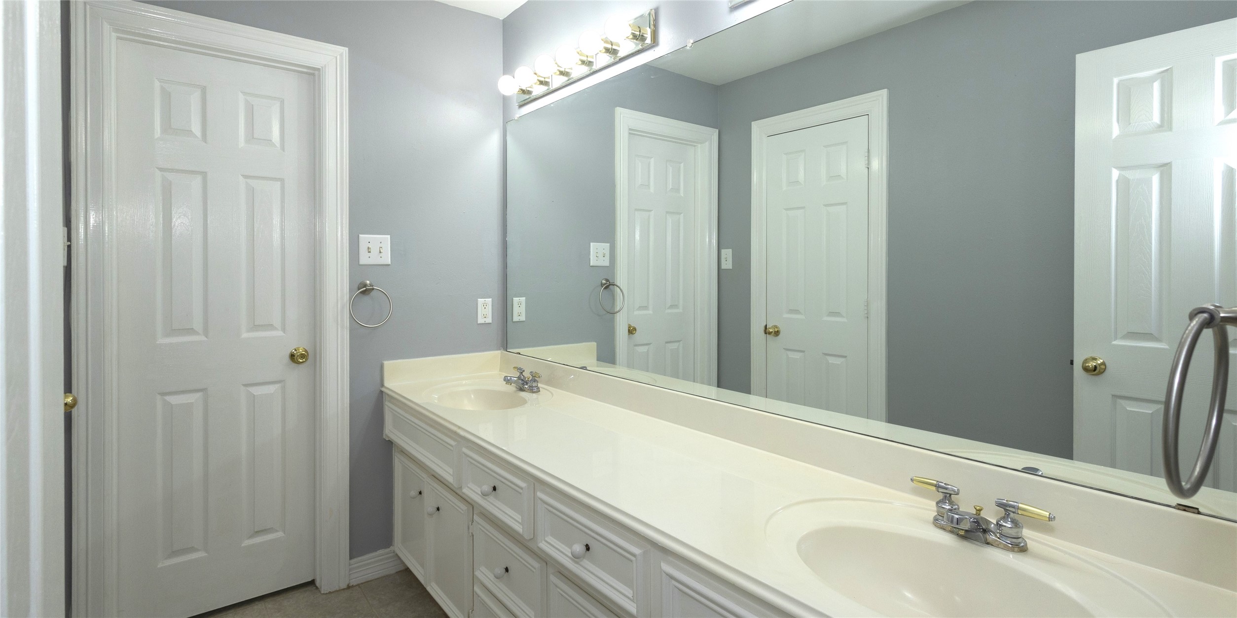 4402 Prince Pine Trail Houston, TX 77059 - Photo 17 of 23 a bathroom with a sink and a mirror