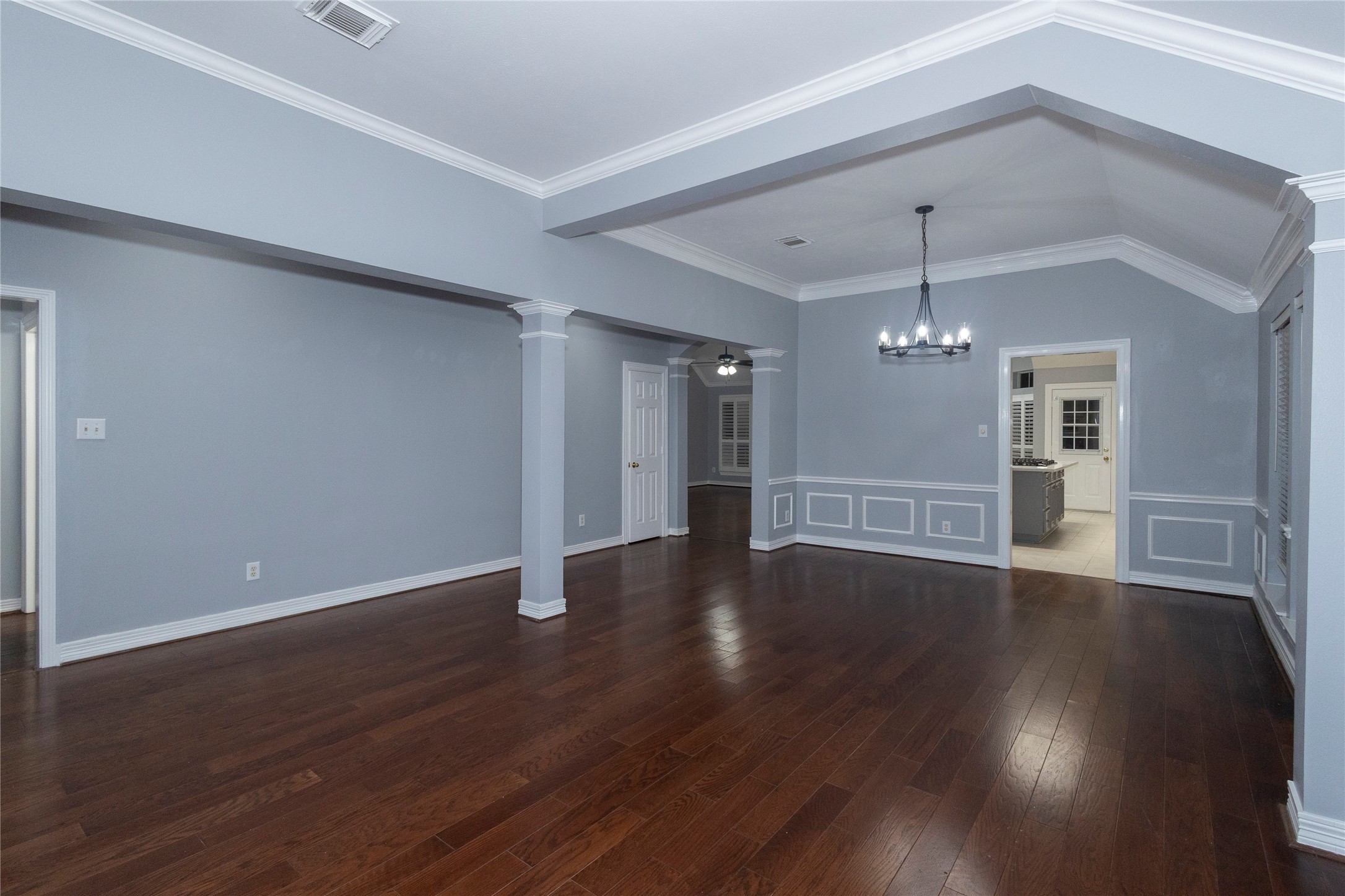 4402 Prince Pine Trail Houston, TX 77059 - Photo 7 of 23 a view of an empty room with wooden floor and a window