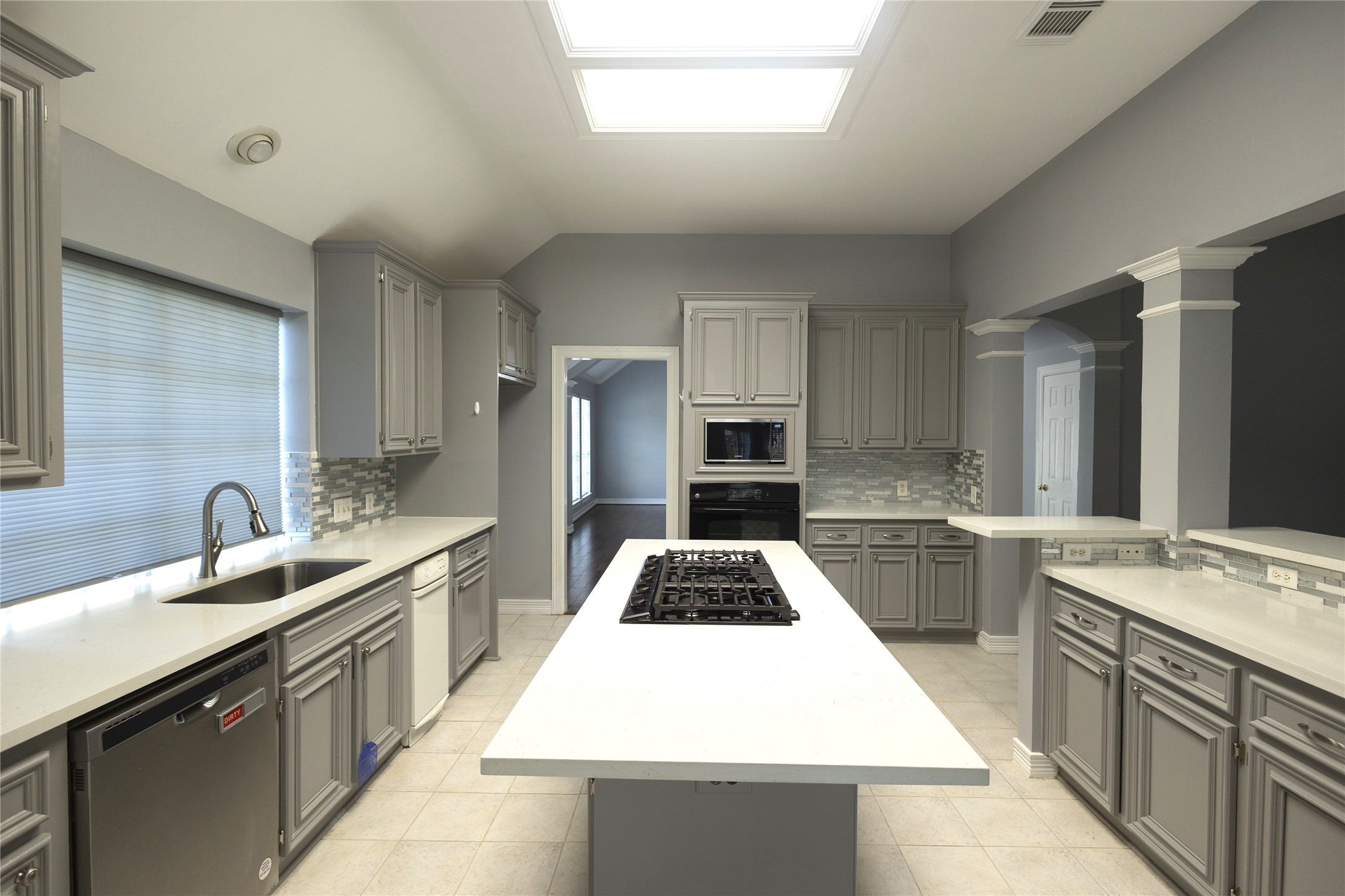 4402 Prince Pine Trail Houston, TX 77059 - Photo 9 of 23 a kitchen with a sink stove and refrigerator