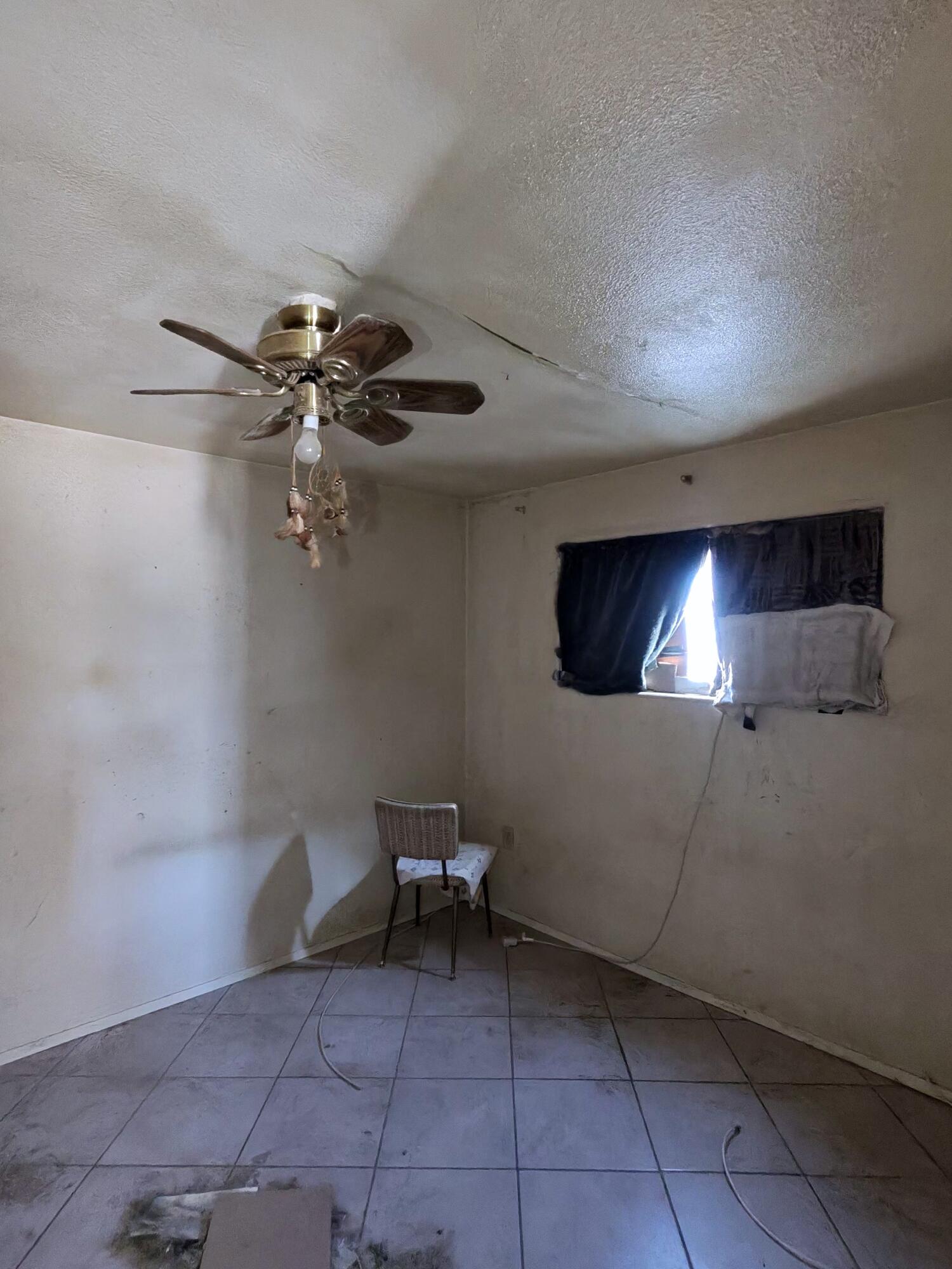 64625 Sonora Road Joshua Tree, CA 92252 - Photo 13 of 17 a view of a livingroom with furniture and chandelier fan