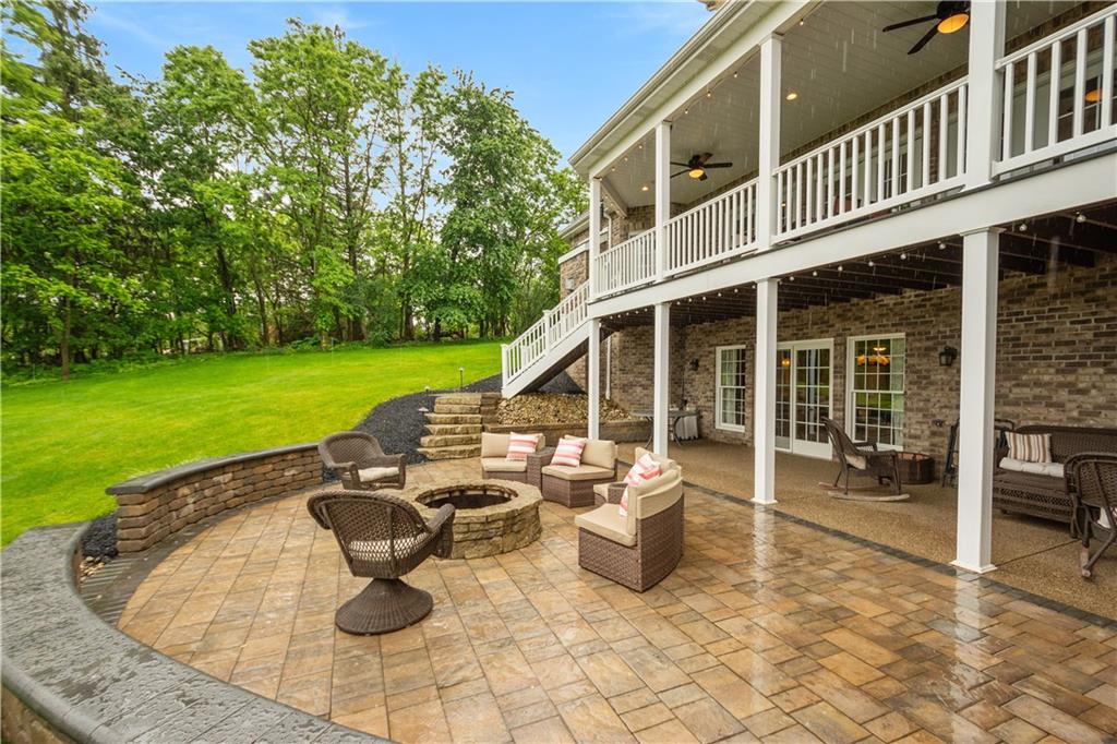 1272 McEwen Road Canonsburg, PA 15317 - Photo 43 of 50 The stamped concrete patio and deck overlook thebeautiful backyard.