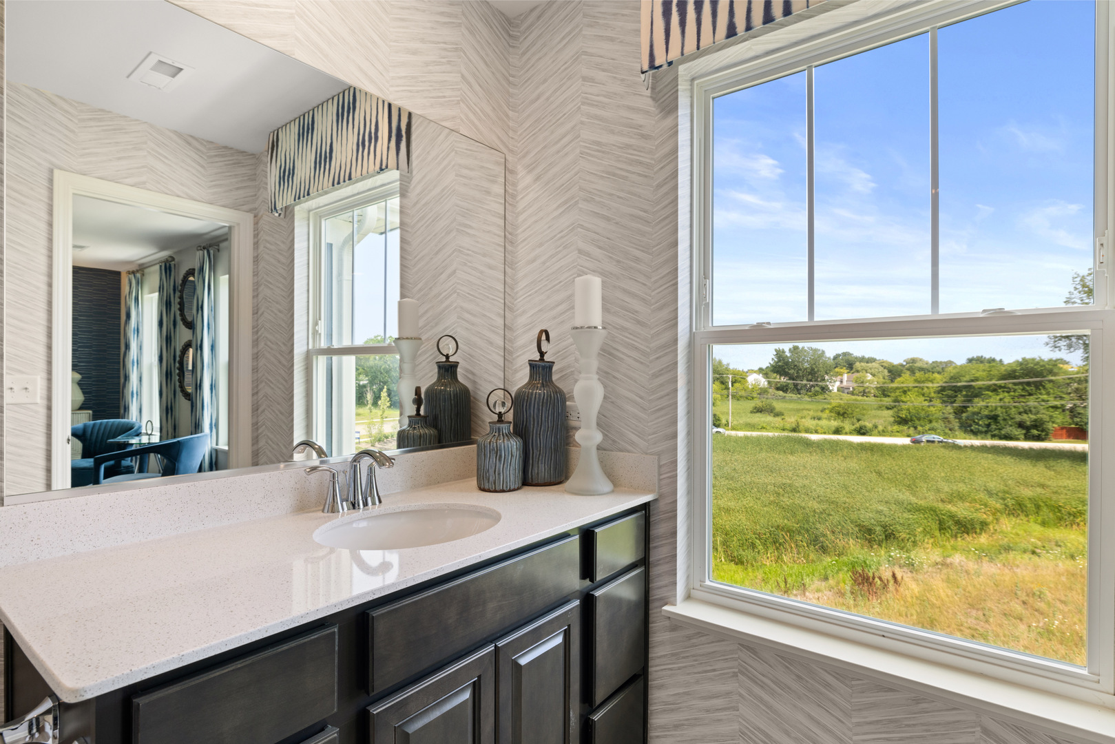 543 Wolverine Drive Aurora, IL 60502 - Photo 21 of 30 a bathroom with a sink and a large mirror next to a window