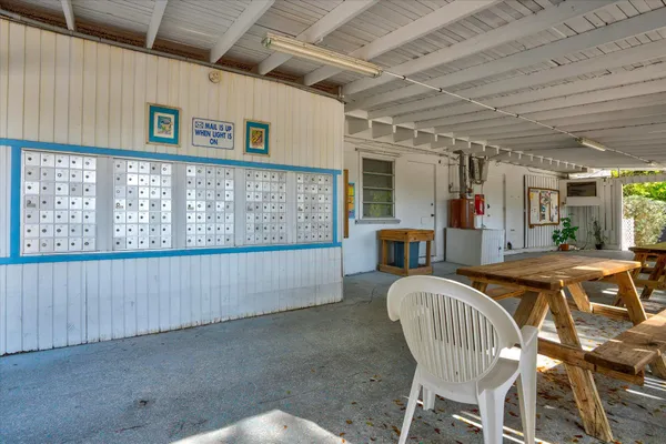 a view of a house with backyard porch and sitting area