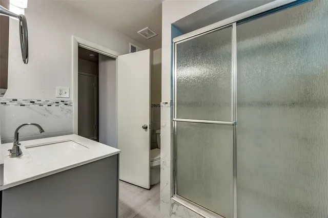 a bathroom with a sink and mirror