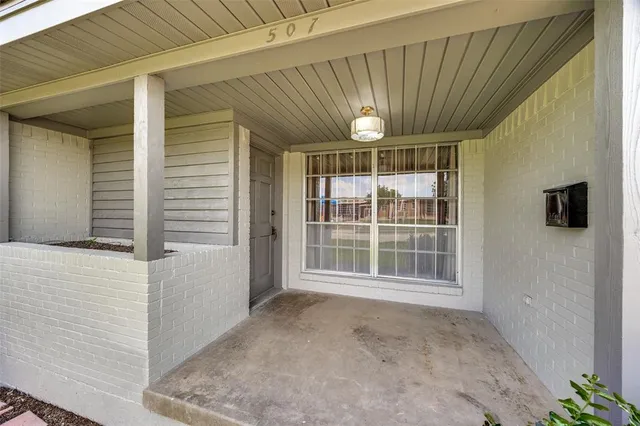 a view of empty room with windows