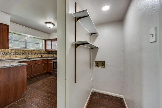 a kitchen with a refrigerator and stove