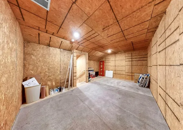 a aerial view of a house with a yard and plants