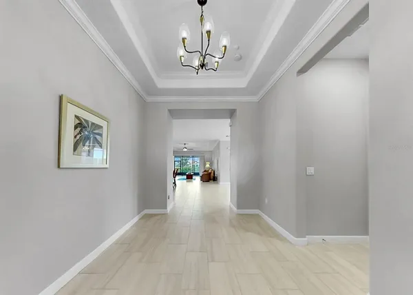 a kitchen with stainless steel appliances a dining table chairs and stove top oven