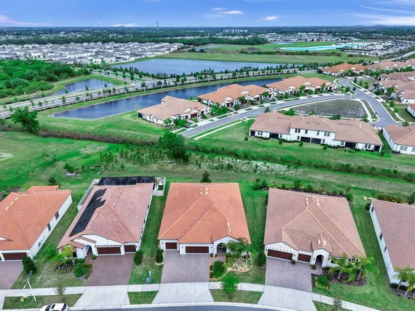 an aerial view of a house with a lake view