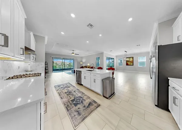 a kitchen with a sink and cabinets