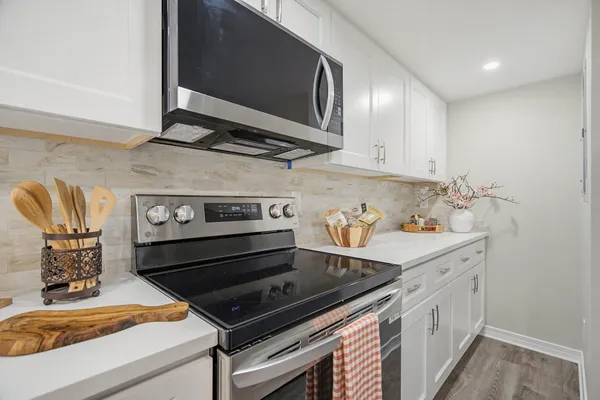 a view of a workspace with furniture and a potted plant