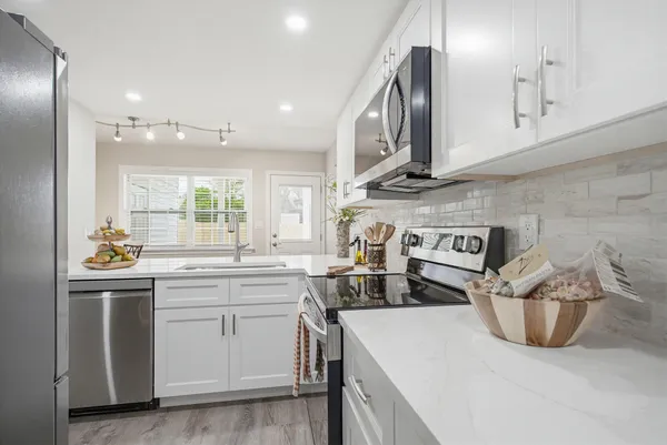 a view of a workspace room with furniture and wooden floor