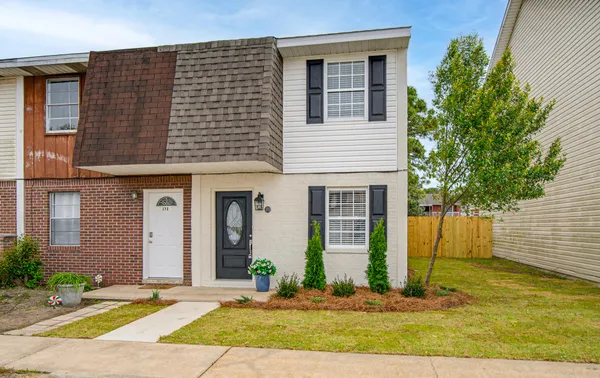 a front view of a house with a yard