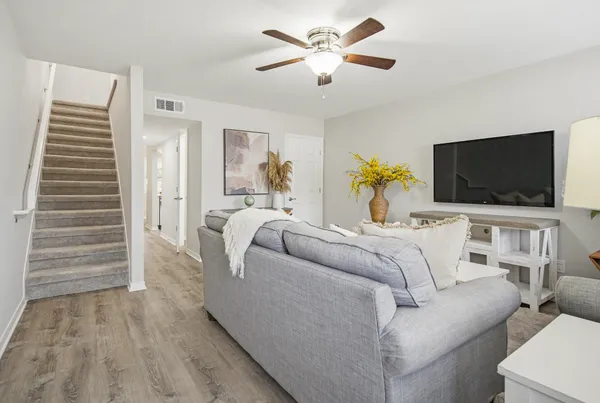 a living room with furniture and a flat screen tv
