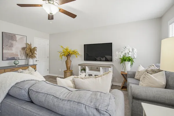 a living room with furniture and a flat screen tv