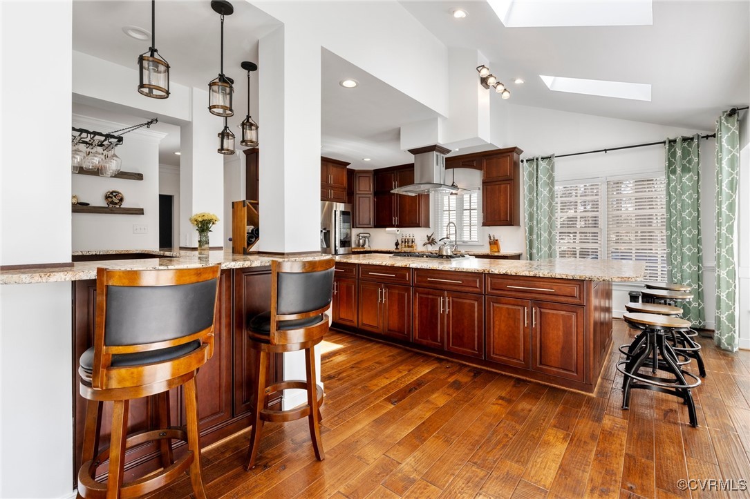 3813 Hackamore Lane Henrico, VA 23233 - Photo 17 of 45 a kitchen with stainless steel appliances granite countertop wooden cabinets and a stove