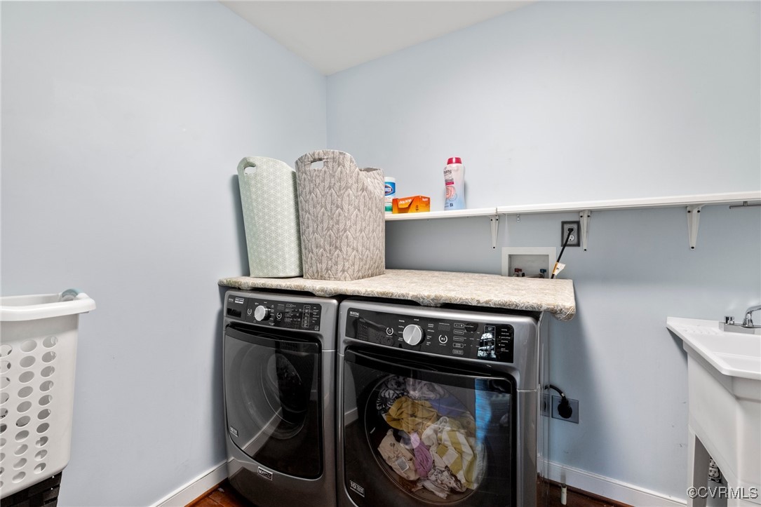 3813 Hackamore Lane Henrico, VA 23233 - Photo 37 of 45 a utility room with dryer and washer