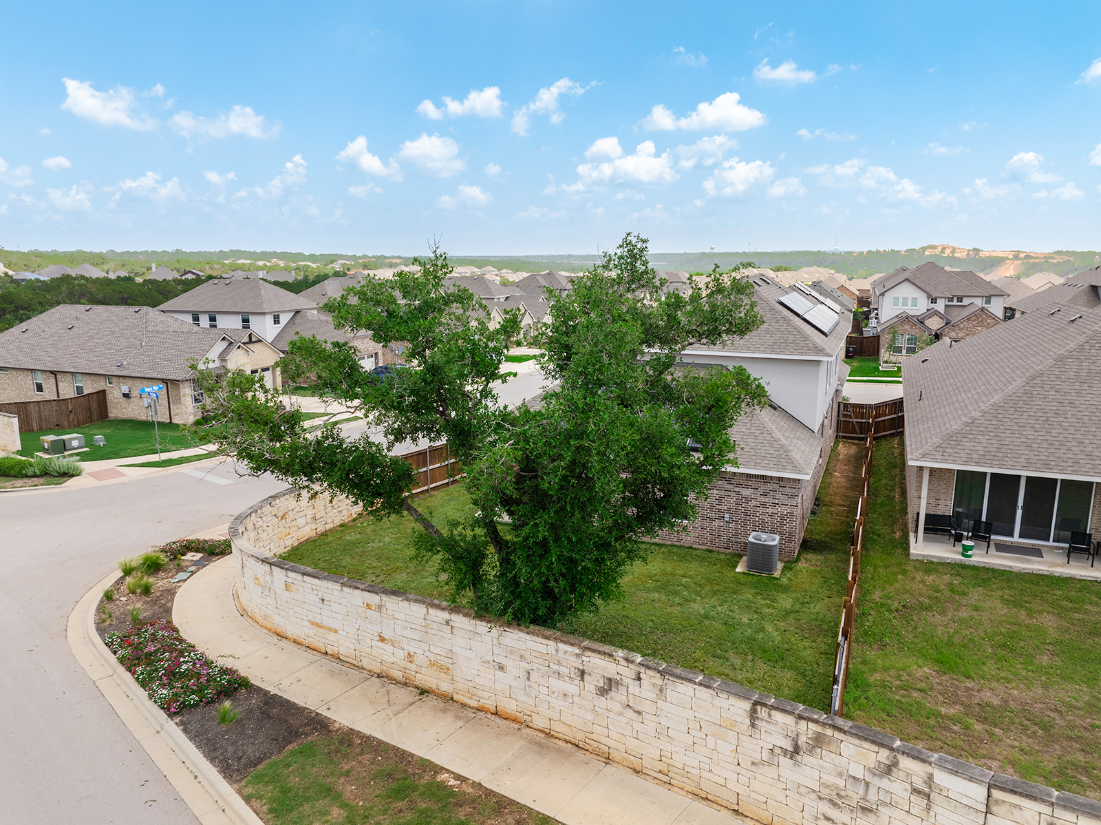 900 Balsora Cove Georgetown, TX 78628 - Photo 27 of 39 A well-maintained neighborhood setting offers private yards and established trees.