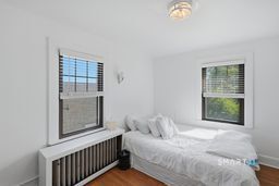 443 Highland Avenue Waterbury, CT 06708 - Photo 12 of 24 a bedroom with a bed and a window