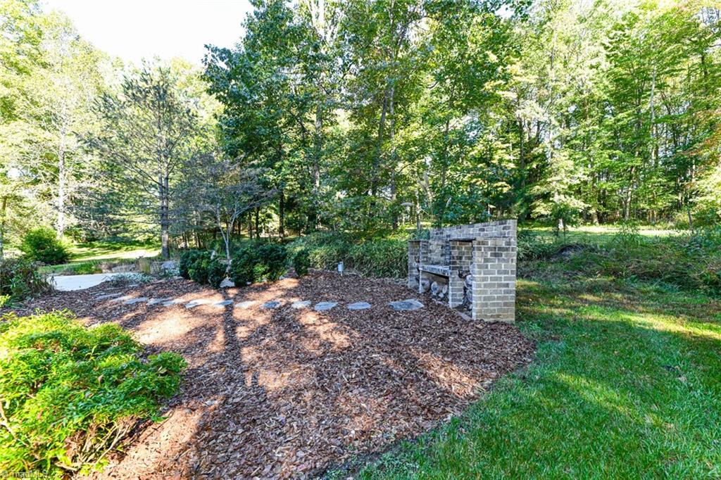 8002 White Ash Court Oak Ridge, NC 27310 - Photo 48 of 50 Back yard cooking/entertaining area.