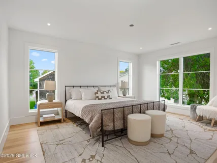 a bedroom with a bed and a couch