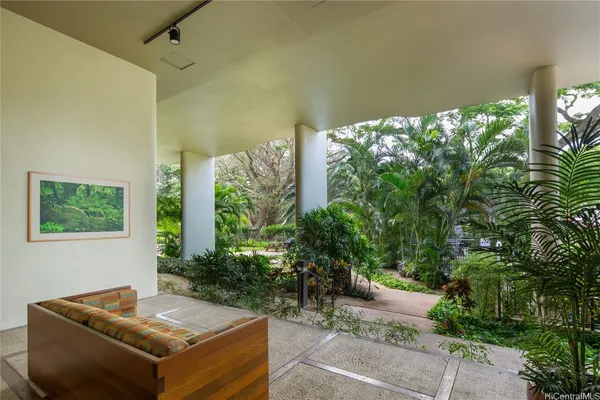a outdoor living space with furniture and garden view