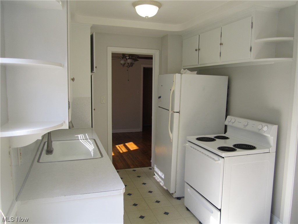 3812 Warrendale Road Cleveland, OH 44118 - Photo 15 of 32 Another view of kitchen with electric stove and fridge.
