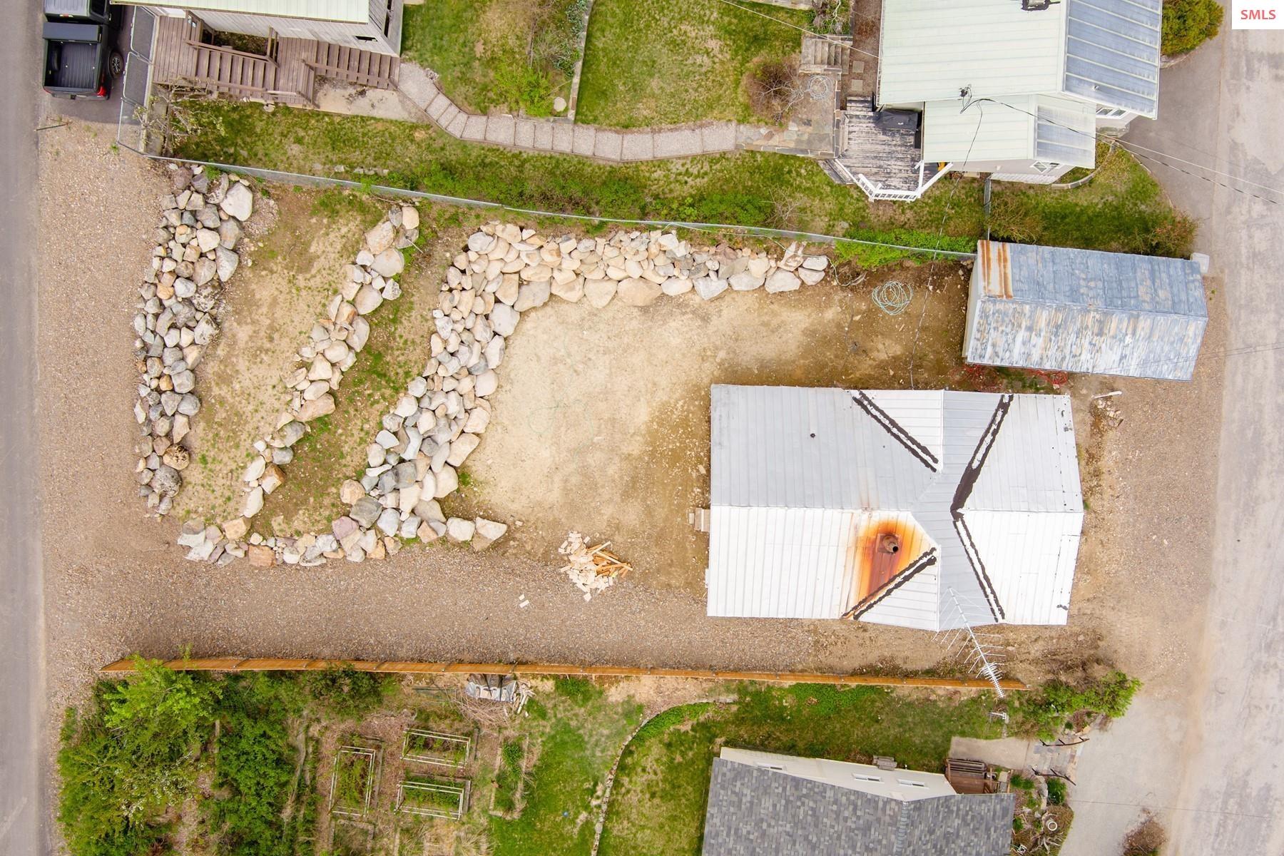 525 Big Hill Road Hope, ID 83836 - Photo 10 of 17 Over 50 truck loads of dirt hauled out and 20 truck loads of rock for the retainer wall.