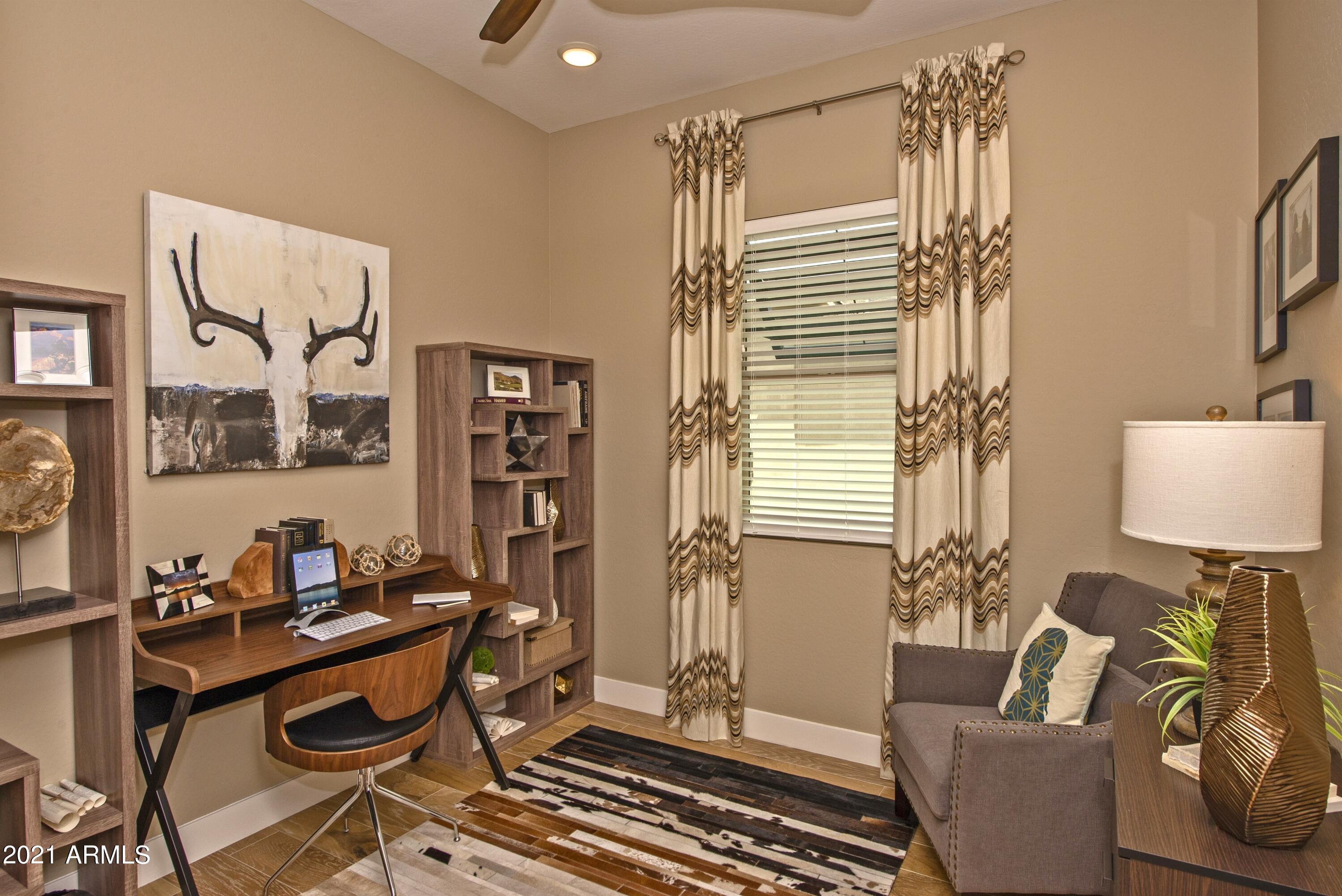 6565 East Thomas Road, Unit 1042 Scottsdale, AZ 85251 - Photo 14 of 22 a living room with furniture and wooden floor