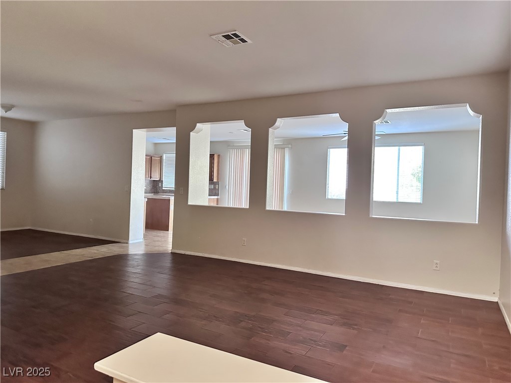 9676 Ridgebluff Avenue Las Vegas, NV 89148 - Photo 2 of 15 Unfurnished room featuring dark wood-style flooring