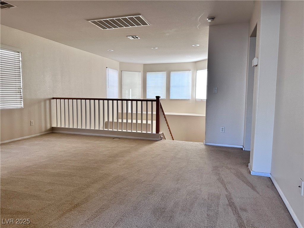 9676 Ridgebluff Avenue Las Vegas, NV 89148 - Photo 9 of 15 Unfurnished room featuring carpet and baseboards