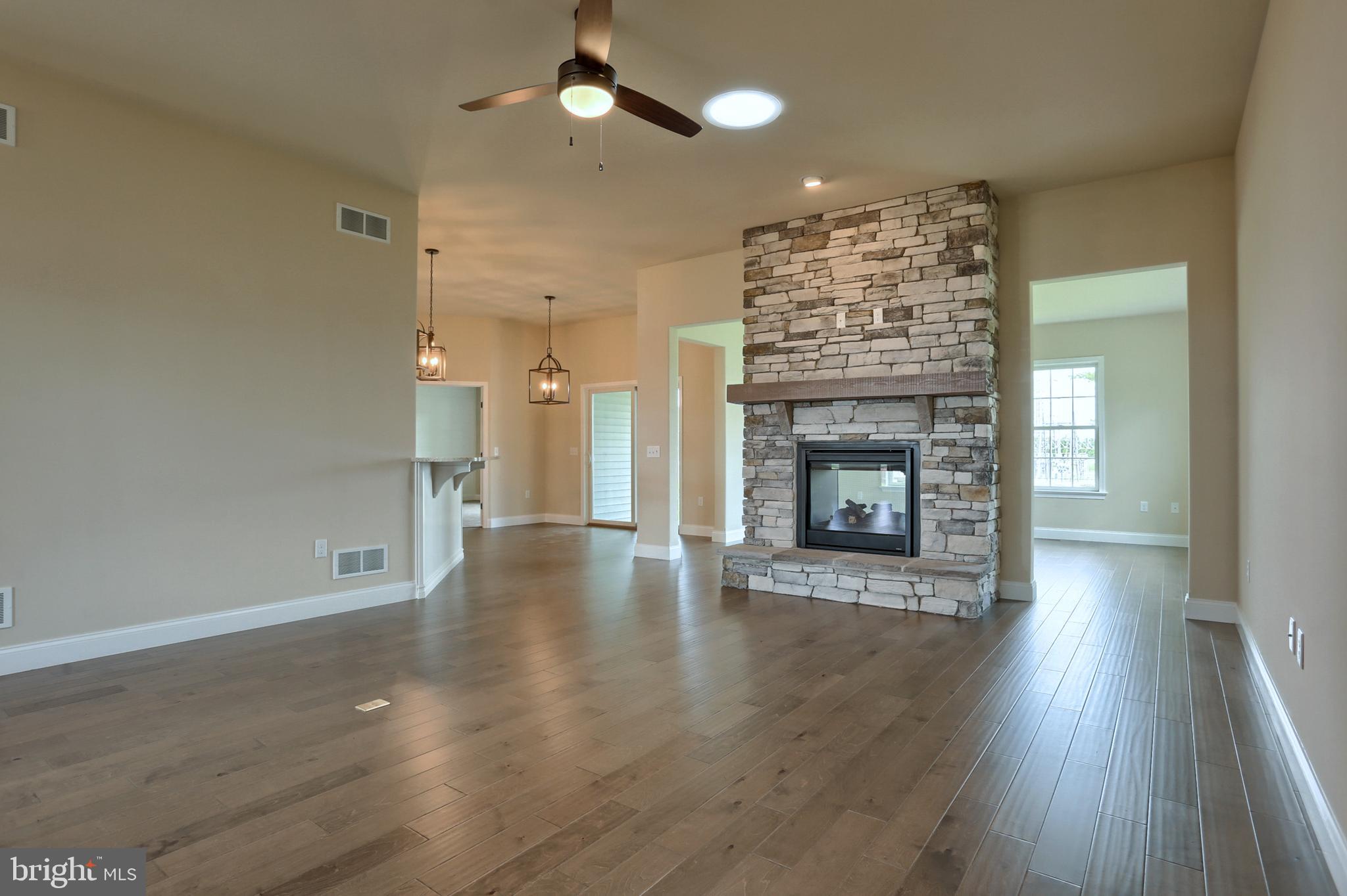 22 Rolling Meadow Road Lebanon, PA 17046 - Photo 13 of 38 an empty room with wooden floor fireplace and windows