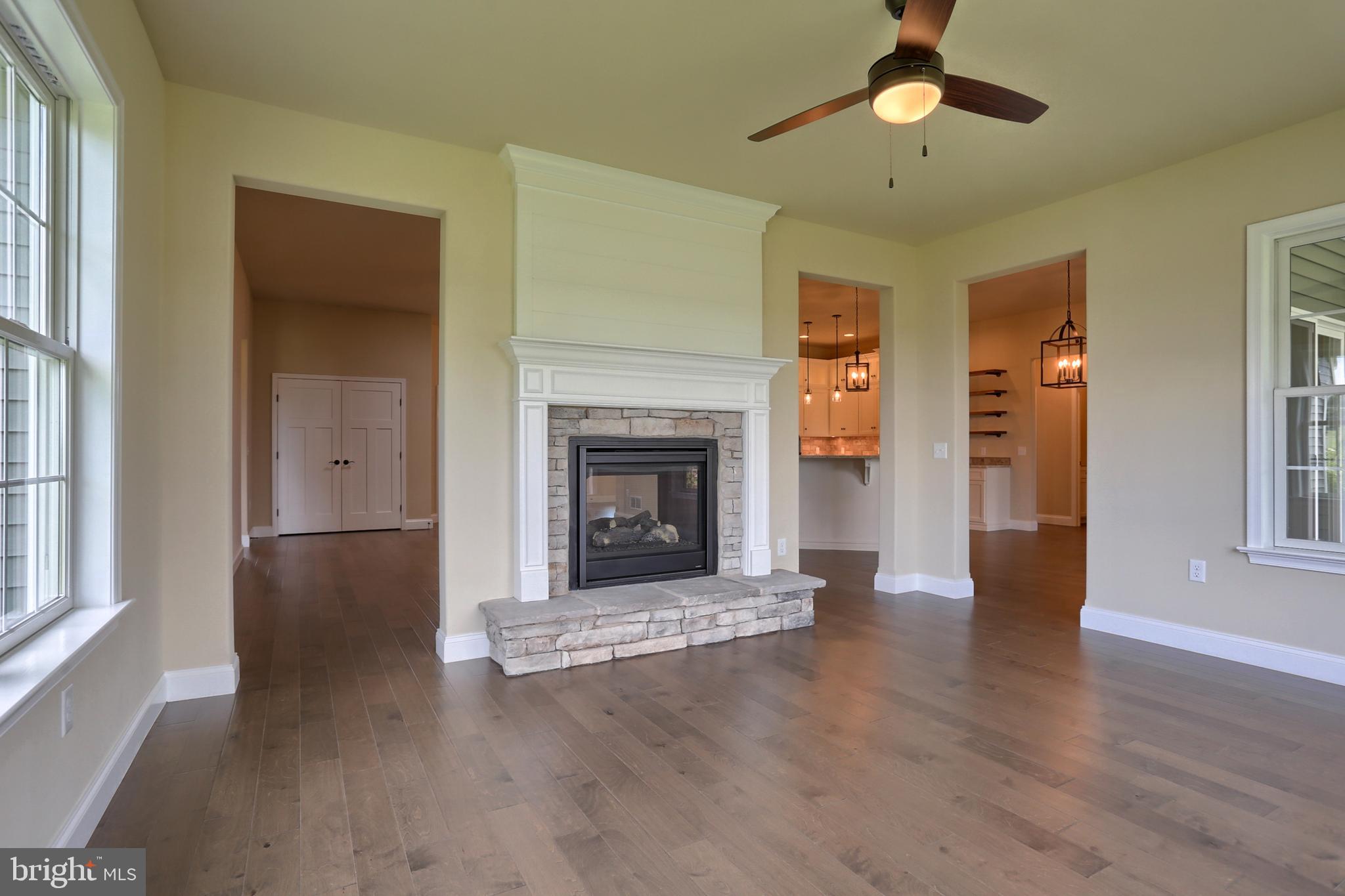22 Rolling Meadow Road Lebanon, PA 17046 - Photo 16 of 38 a view of an empty room with wooden floor fireplace and a window