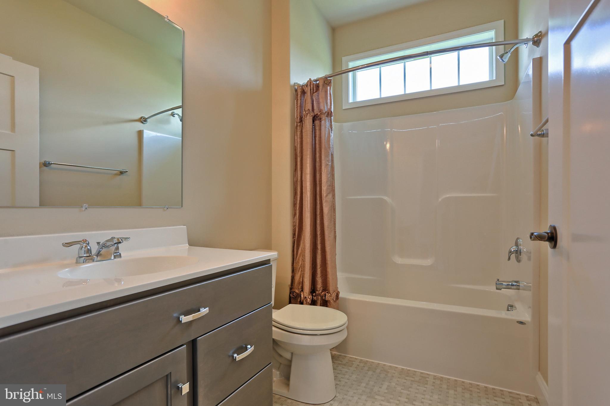 22 Rolling Meadow Road Lebanon, PA 17046 - Photo 30 of 38 a bathroom with a sink a toilet and shower