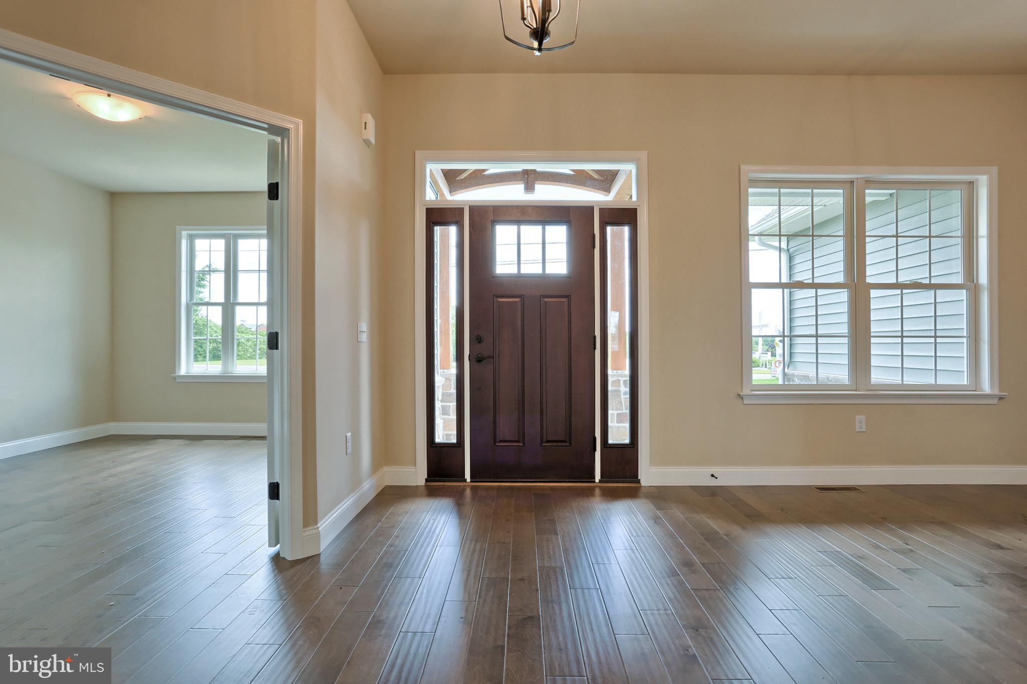 22 Rolling Meadow Road Lebanon, PA 17046 - Photo 7 of 38 an empty room with wooden floor and windows
