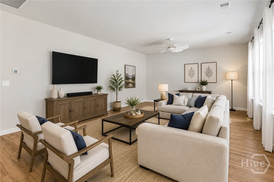 136 Binscombe Lane Pooler, GA 31322 - Photo 6 of 41 Great Room. *This photo has been virtually staged to illustrate the home’s design possibilities and room functionality. Furnishings and décor shown are digital renderings and are not included with the property.