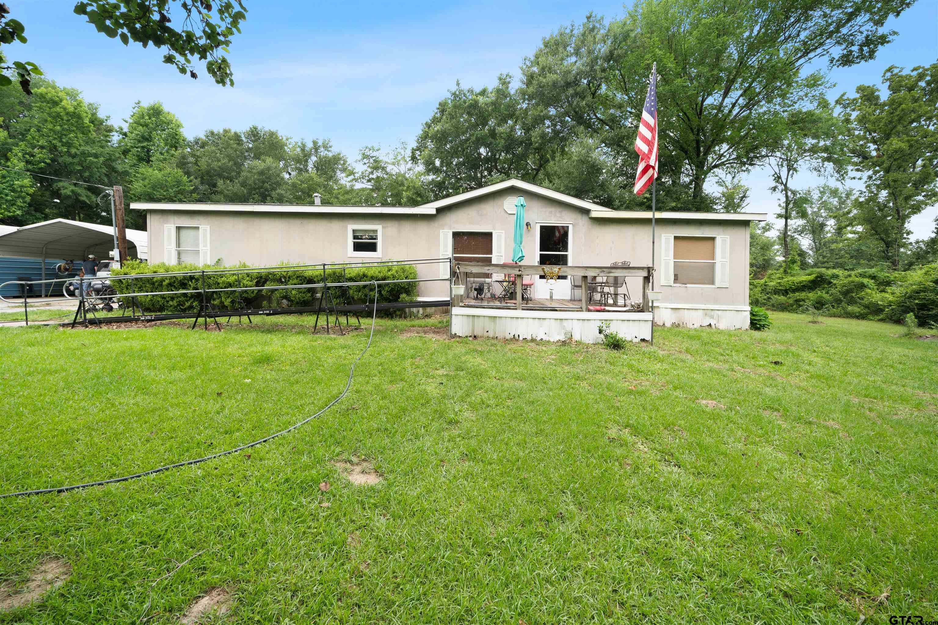 2425 Thompson Lane Tyler, TX 75704 - Photo 7 of 27 a front view of a house with yard and green space
