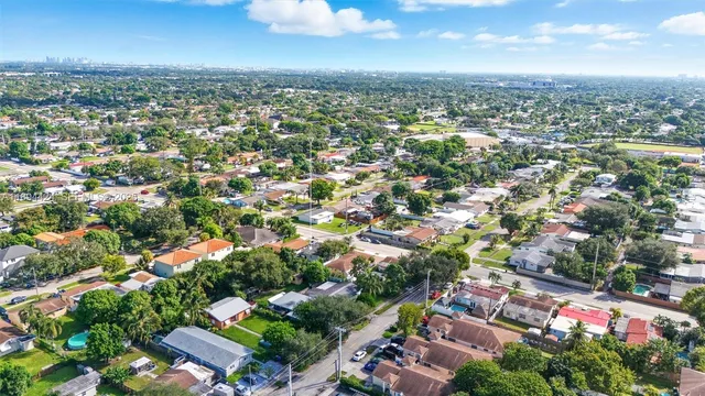 a view of a house with a yard and plants