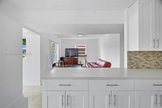 a kitchen with cabinets and appliances