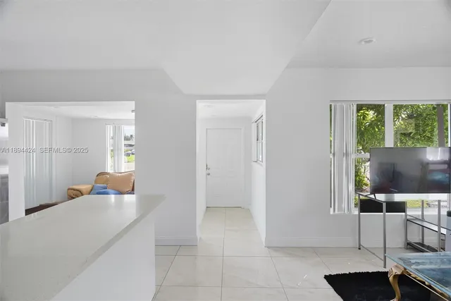 a living room with a couch and a flat screen tv