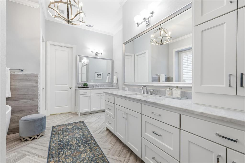 921 Winding Ridge Trail Southlake, TX 76092 - Photo 19 of 40 a spacious bathroom with a double vanity sink a mirror and a shower