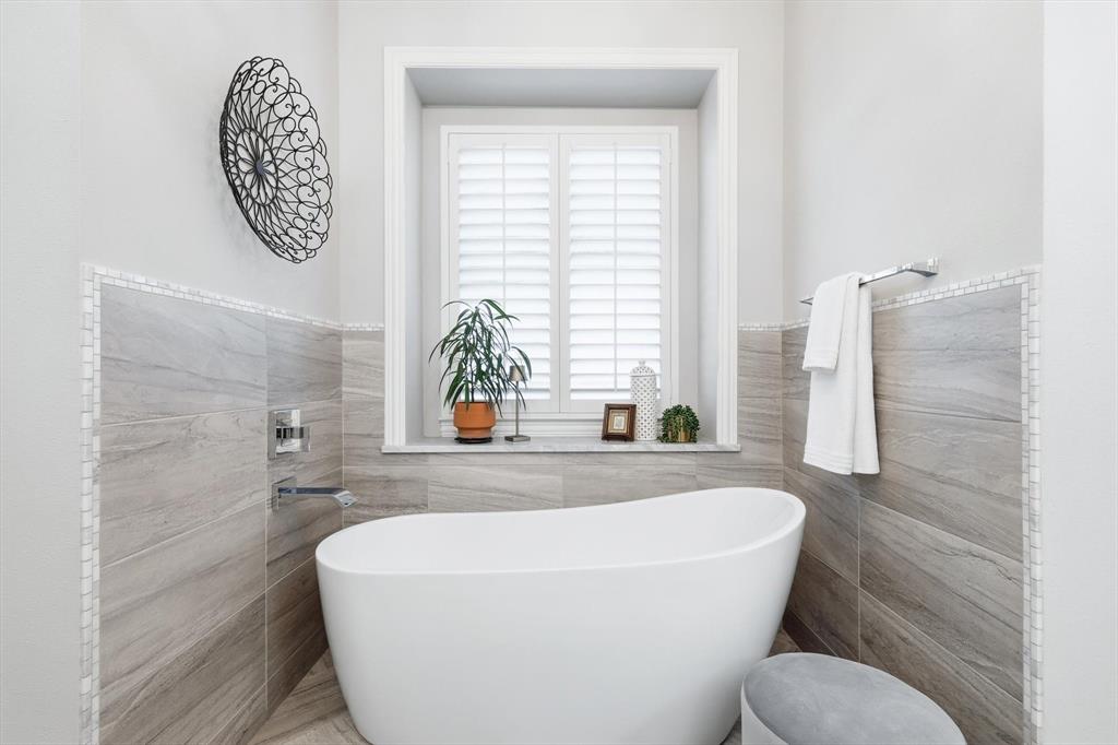 921 Winding Ridge Trail Southlake, TX 76092 - Photo 20 of 40 a white bath tub sitting next to a white toilet